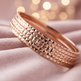 Rose Gold Diamond-Cut Bangle on blush pink velvet